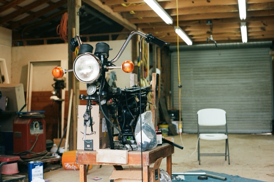 A motorcycle on the bench, Woodbury. 2024.